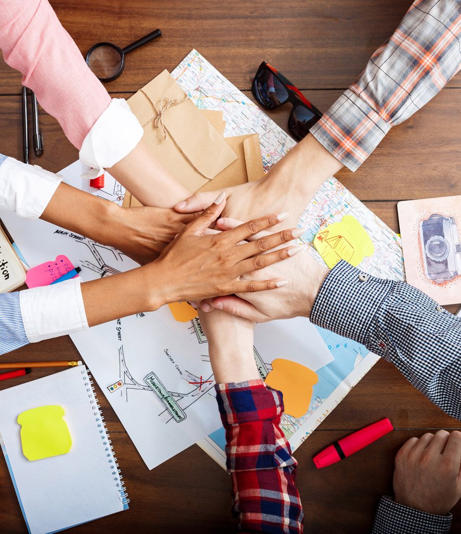 businessmen hands wooden table with documents drafts